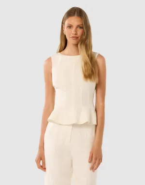 An elegant peplum top in porcelain white. This top can work with skirts, pants and jeans and is a perfect base layer with a point of difference.