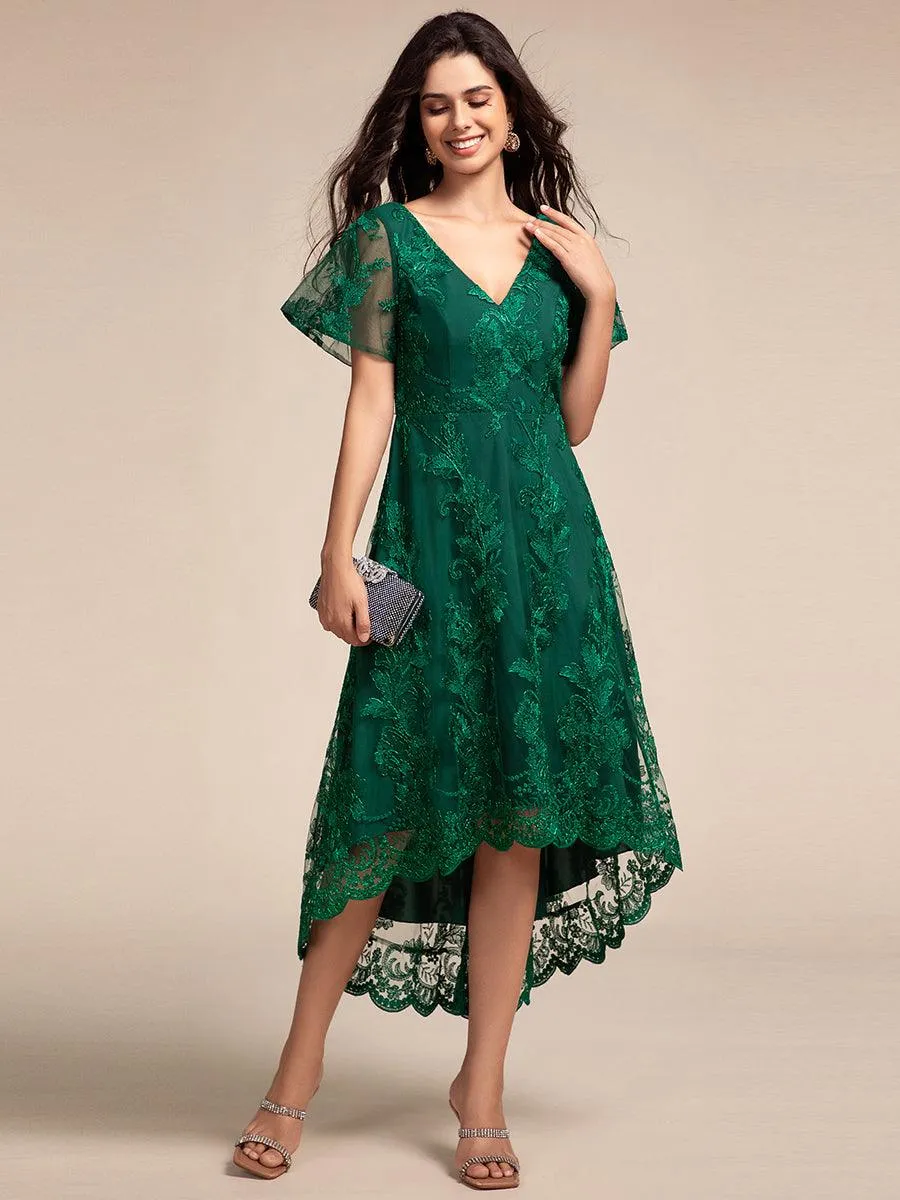 Robe d'invitée de mariage mi-longue à manches courtes et col en V double en maille brodée