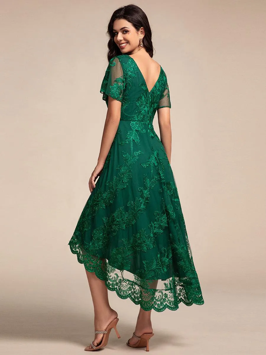 Robe d'invitée de mariage mi-longue à manches courtes et col en V double en maille brodée