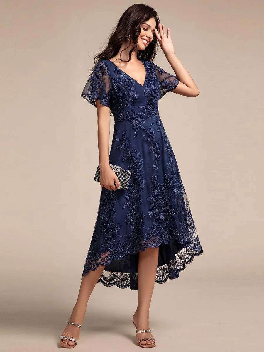 Robe d'invitée de mariage mi-longue à manches courtes et col en V double en maille brodée