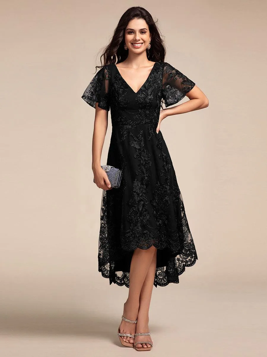 Robe d'invitée de mariage mi-longue à manches courtes et col en V double en maille brodée