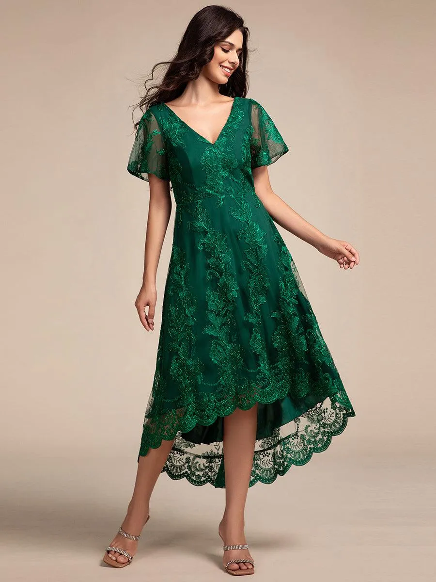 Robe d'invitée de mariage mi-longue à manches courtes et col en V double en maille brodée