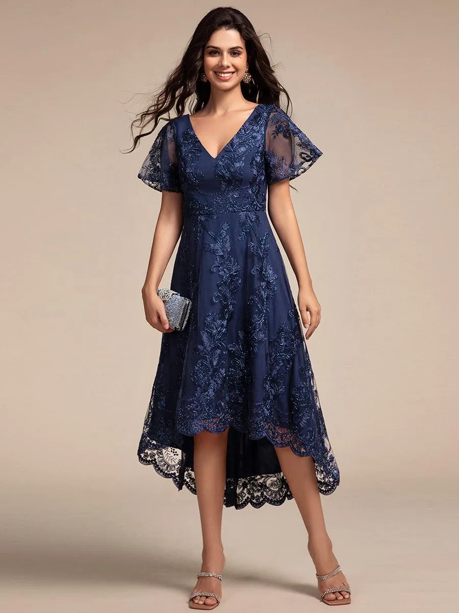 Robe d'invitée de mariage mi-longue à manches courtes et col en V double en maille brodée