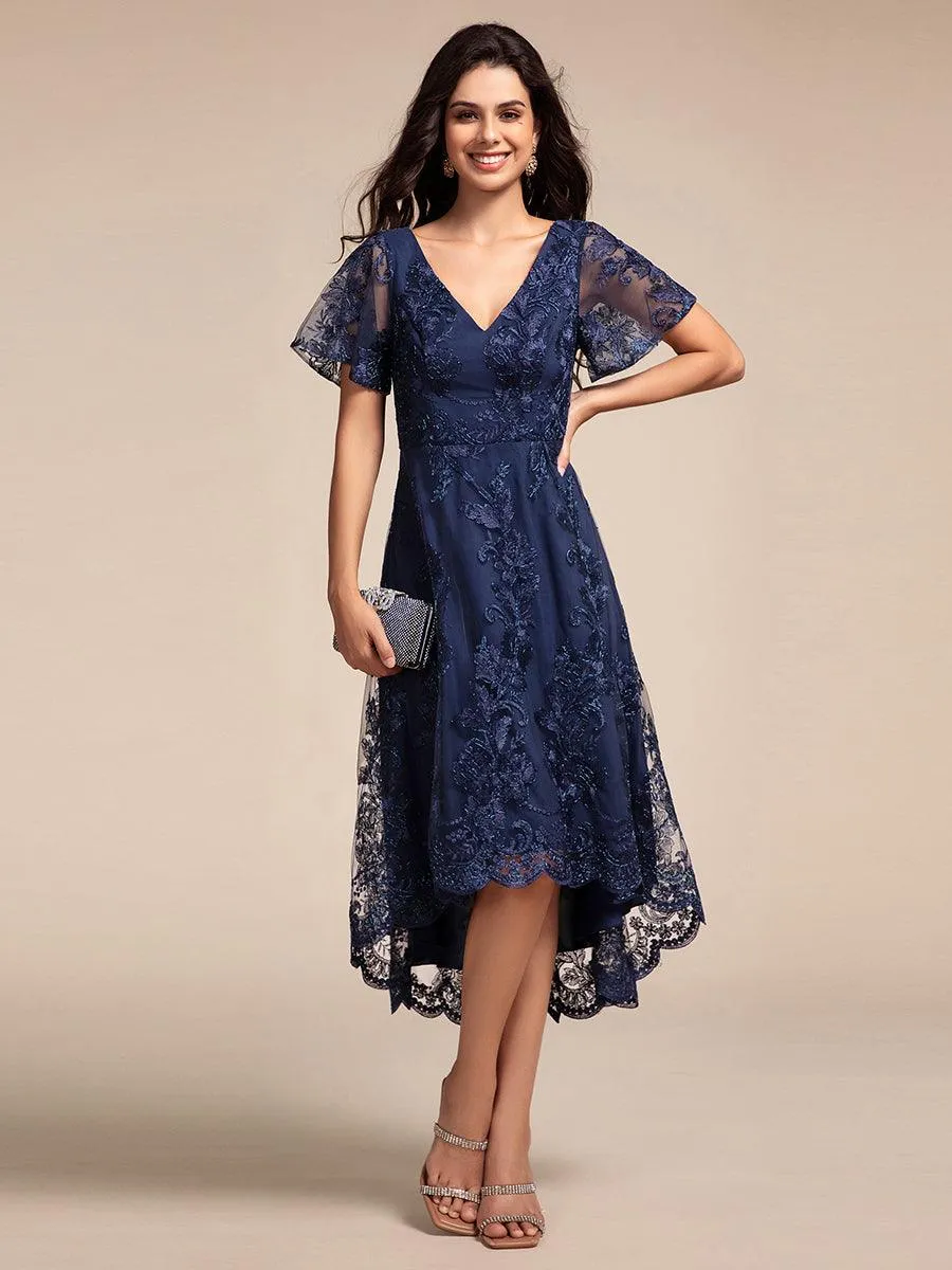 Robe d'invitée de mariage mi-longue à manches courtes et col en V double en maille brodée