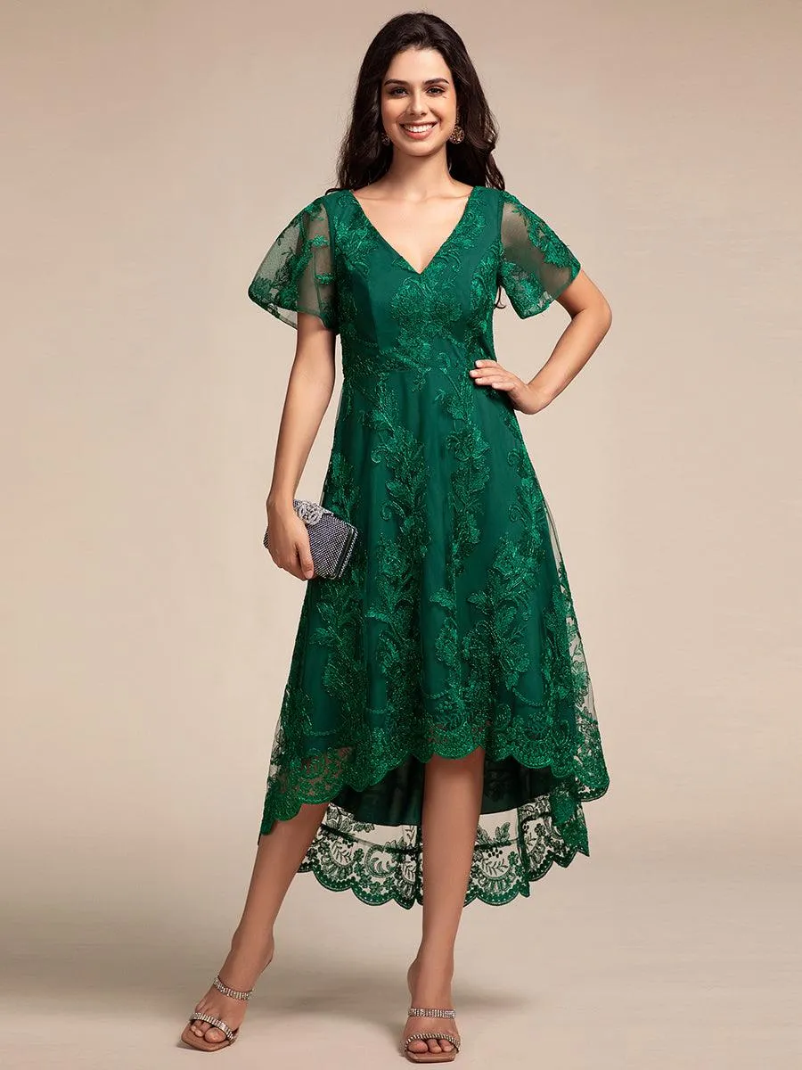 Robe d'invitée de mariage mi-longue à manches courtes et col en V double en maille brodée