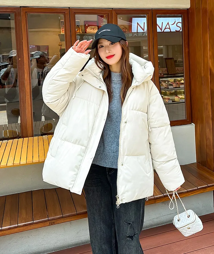 Stylish hooded puffer jacket for women with a relaxed-fit and zip-up closure