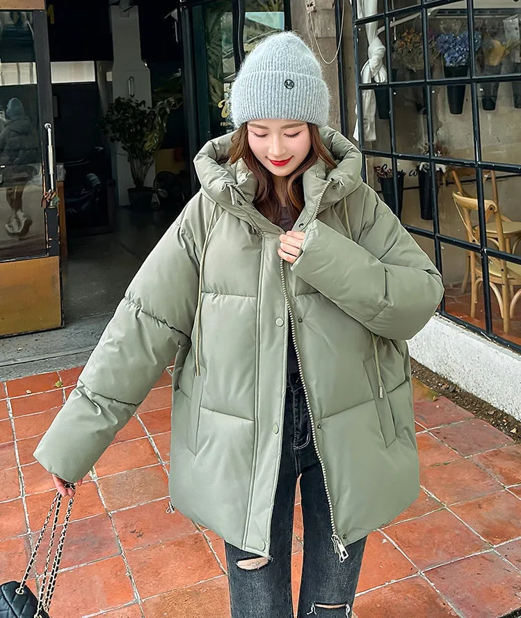 Stylish hooded puffer jacket for women with a relaxed-fit and zip-up closure