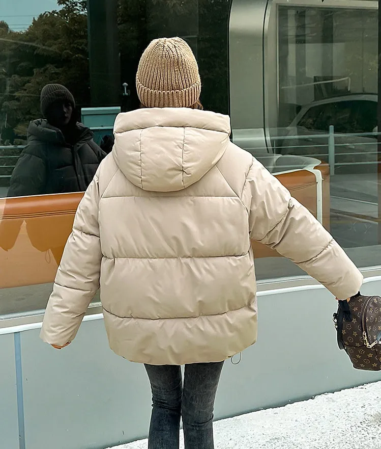 Stylish hooded puffer jacket for women with a relaxed-fit and zip-up closure