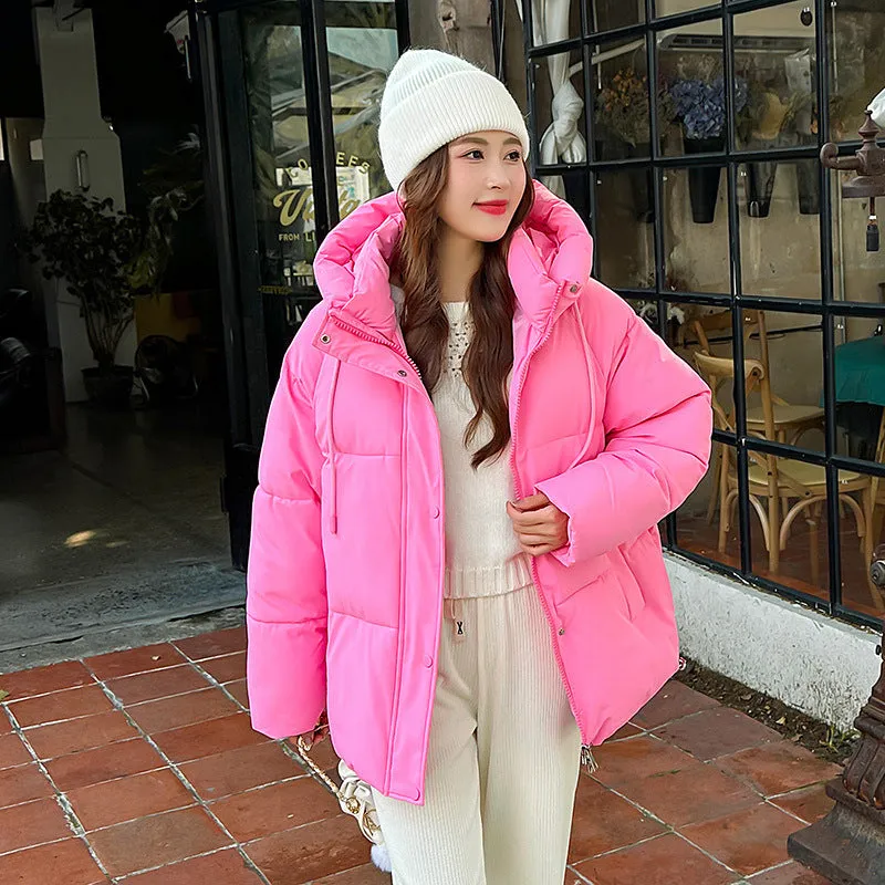 Stylish hooded puffer jacket for women with a relaxed-fit and zip-up closure
