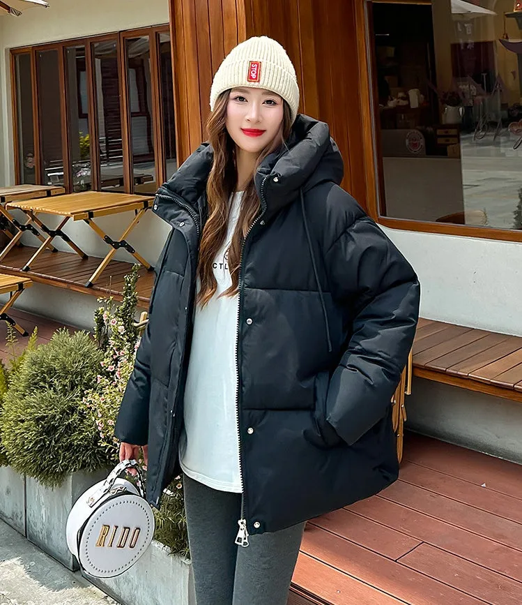Stylish hooded puffer jacket for women with a relaxed-fit and zip-up closure