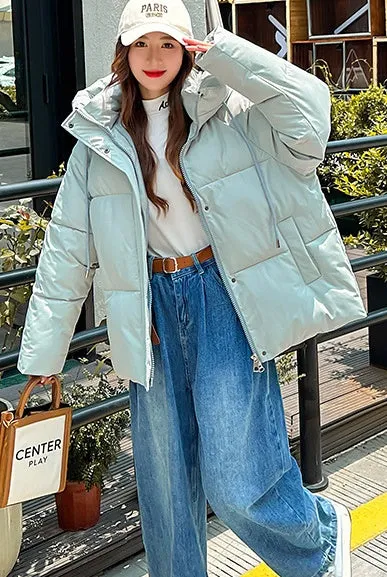 Stylish hooded puffer jacket for women with a relaxed-fit and zip-up closure
