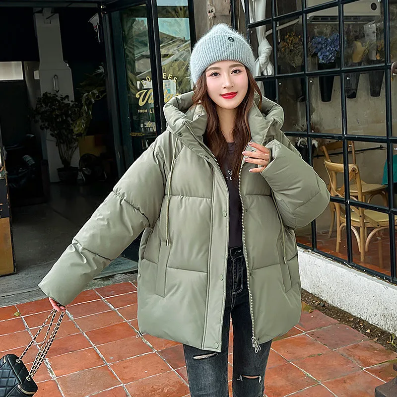 Stylish hooded puffer jacket for women with a relaxed-fit and zip-up closure