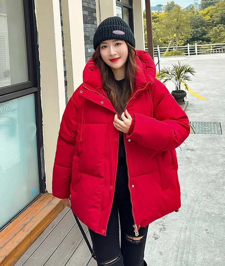 Stylish hooded puffer jacket for women with a relaxed-fit and zip-up closure