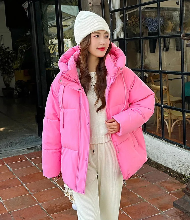 Stylish hooded puffer jacket for women with a relaxed-fit and zip-up closure