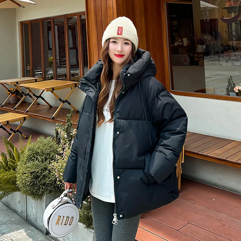 Stylish hooded puffer jacket for women with a relaxed-fit and zip-up closure