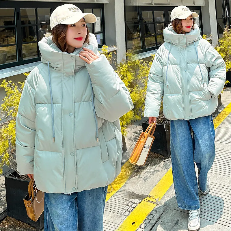 Stylish hooded puffer jacket for women with a relaxed-fit and zip-up closure