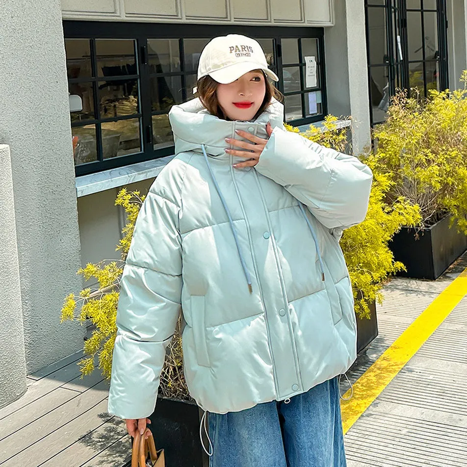 Stylish hooded puffer jacket for women with a relaxed-fit and zip-up closure