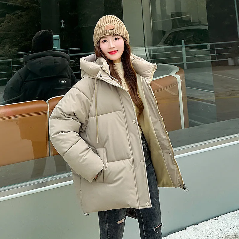 Stylish hooded puffer jacket for women with a relaxed-fit and zip-up closure